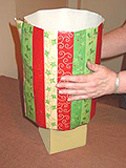 How to Gift Wrap a Round Box step 3